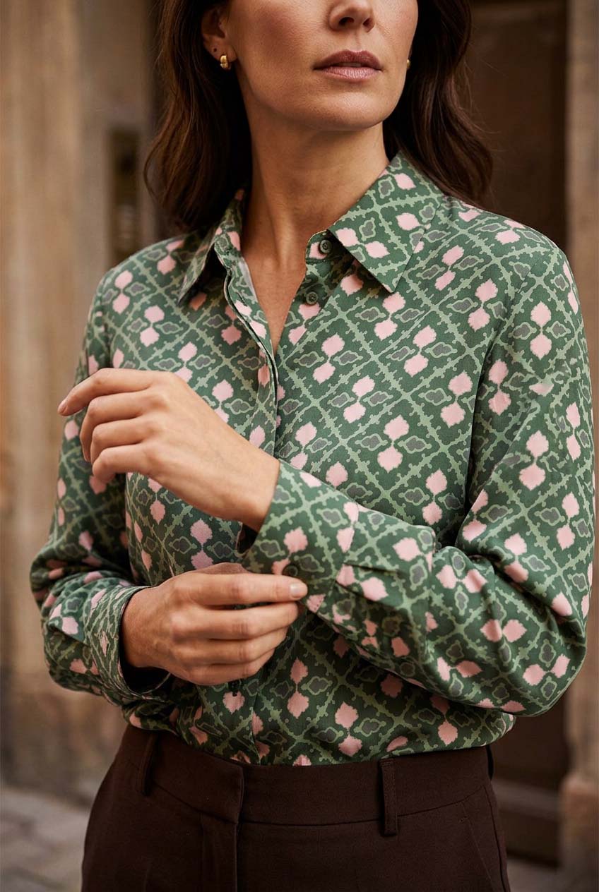 Stars Collared Blouse Mockup — Close-up of green and pale pink geometric print, showing collar and buttoned cuff. GEO0001 ©Byheart Design Sweden