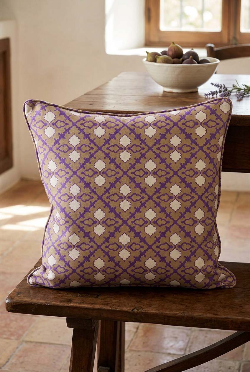 Stars Decorative Cushion Mockup — Violet, ochre and ivory geometric print on a cushion beside a rustic wooden kitchen table. GEO0001 ©Byheart Design Sweden